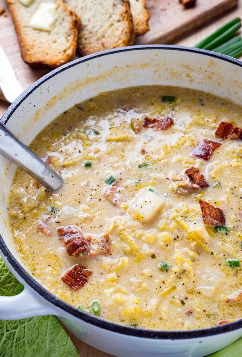Delicious Colcannon Soup with Bacon served in a bowl, garnished with green onions.