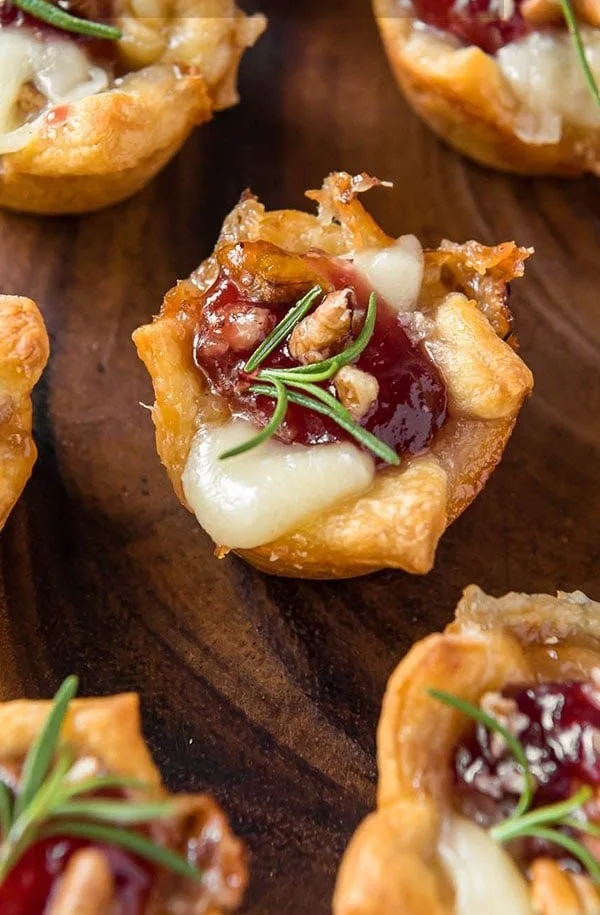 Cranberry Brie Bites served on a platter at a festive gathering.