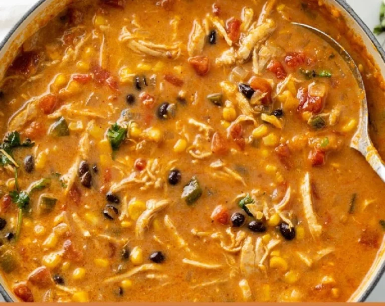 Delicious bowl of creamy chicken tortilla soup topped with tortilla strips