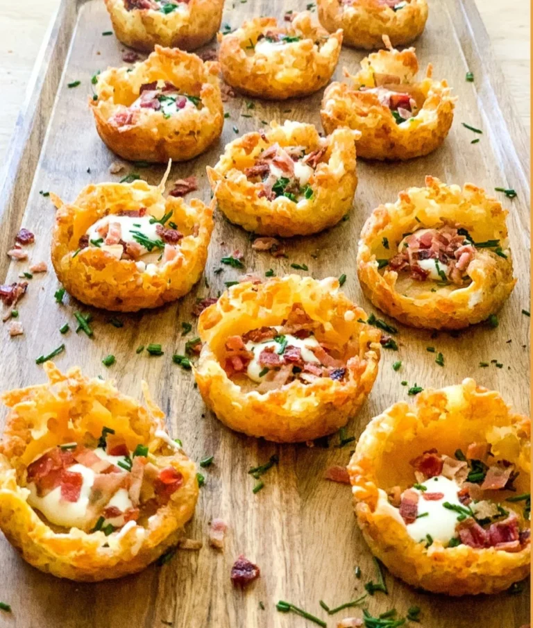 Loaded tater tot appetizers topped with cheese and toppings