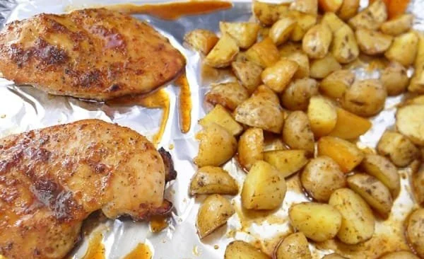 Sheet pan honey glazed chicken with roasted potatoes ready to serve.