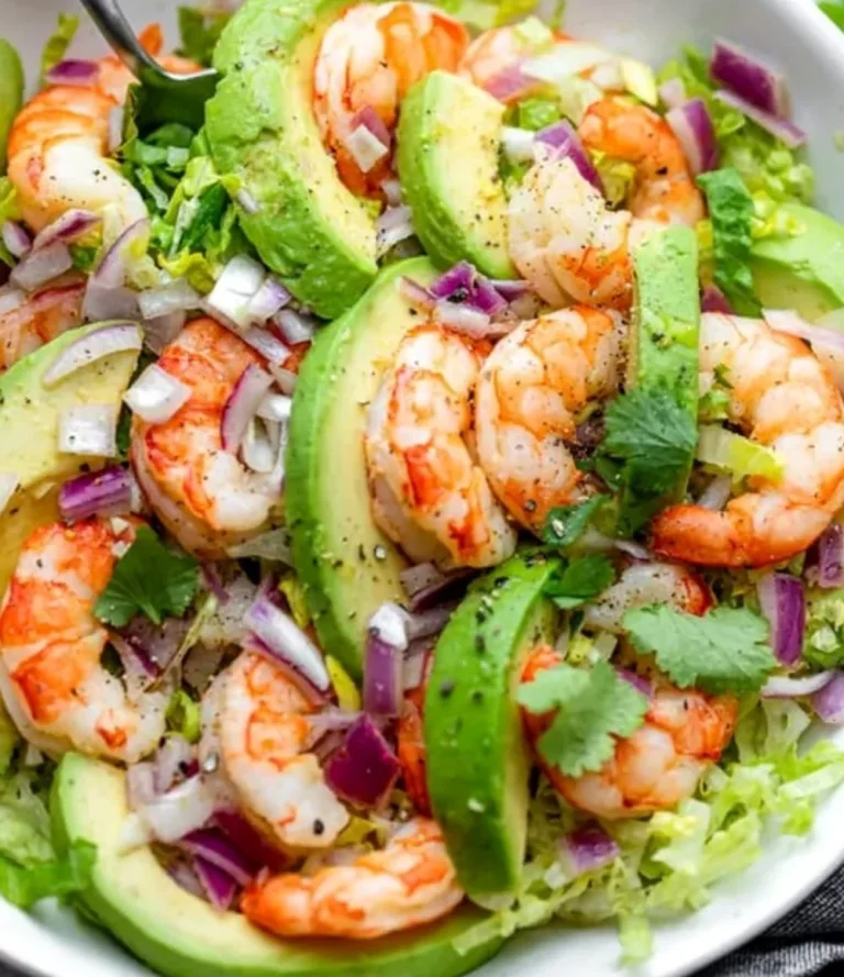 Shrimp and avocado salad with fresh ingredients on a plate