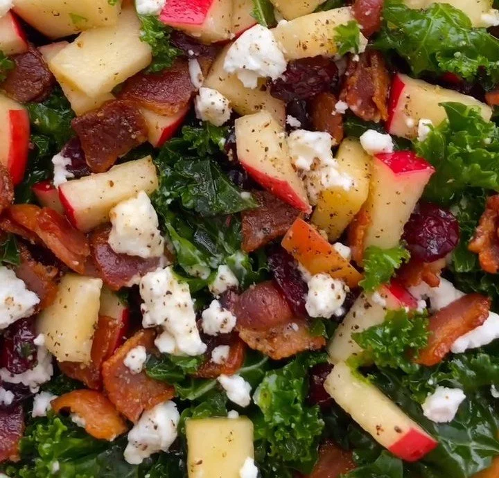 Apple Cranberry Kale Salad with Bacon served in a colorful bowl