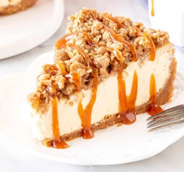 Delicious slice of Apple Crisp Cheesecake with crunchy topping