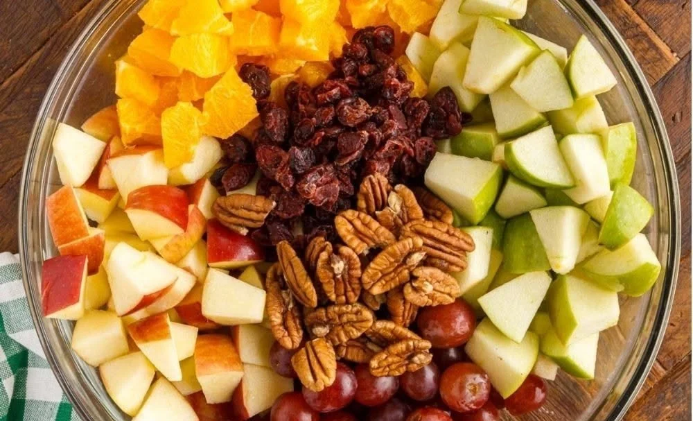 Apple fruit salad with warm fall spice dressing in a bowl