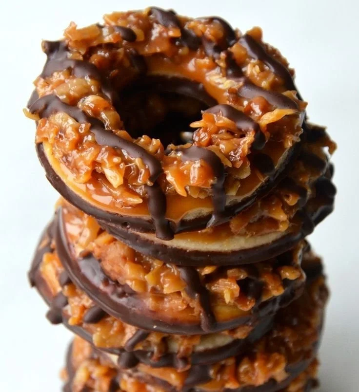 Delicious homemade Samoas cookies topped with chocolate and coconut.