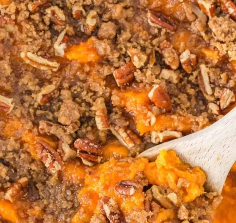 Delicious sweet potato casserole topped with pecans and marshmallows