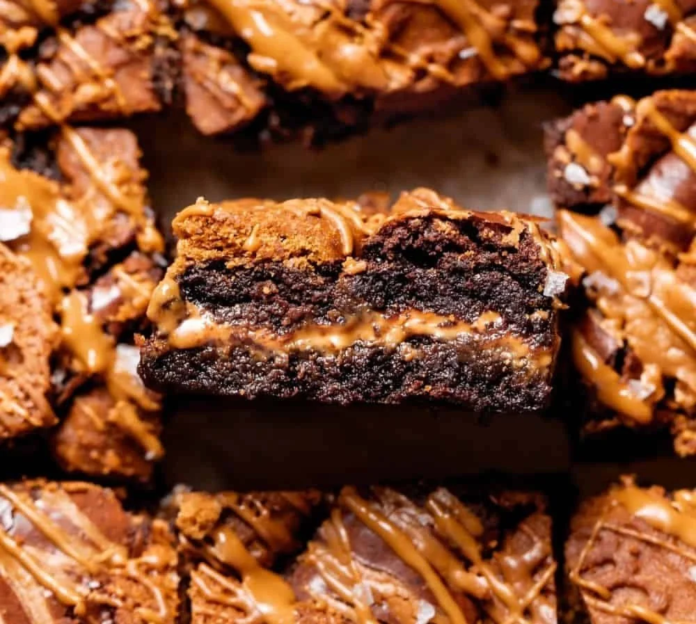 Decadent Biscoff brownies topped with chocolate and Biscoff spread