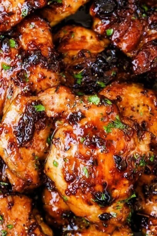 Deliciously cooked boneless honey garlic chicken thighs served on a plate.