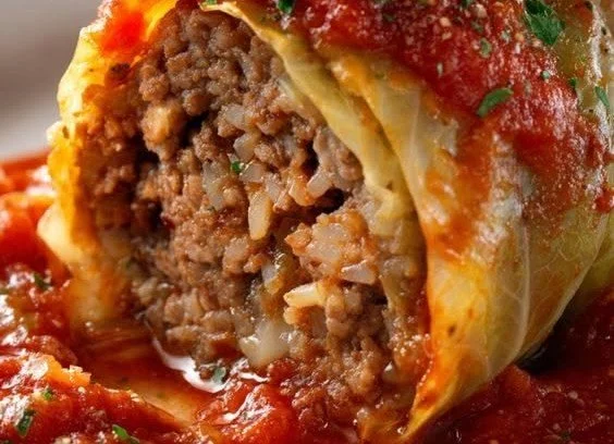 Delicious classic stuffed cabbage rolls fresh out of the oven on a plate.