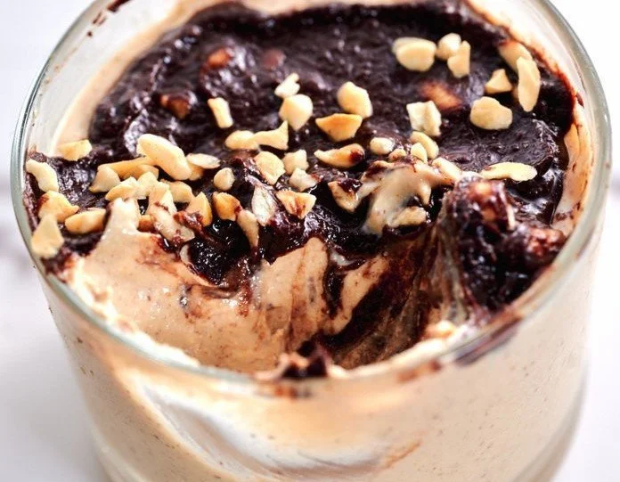 Cottage Cheese Peanut Butter Mousse garnished with nuts in a bowl