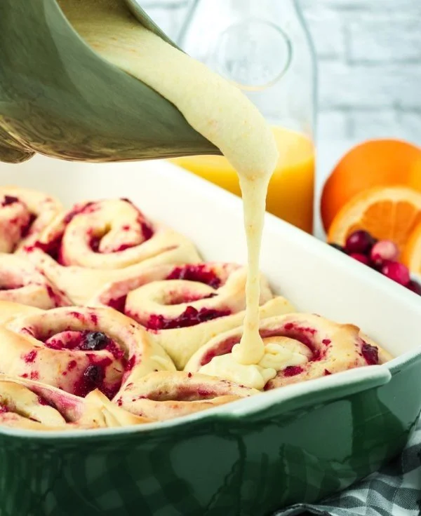 Homemade cranberry orange sweet rolls ready to be served on a plate