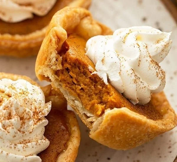 A plate of delicious mini pumpkin pies ready to be served