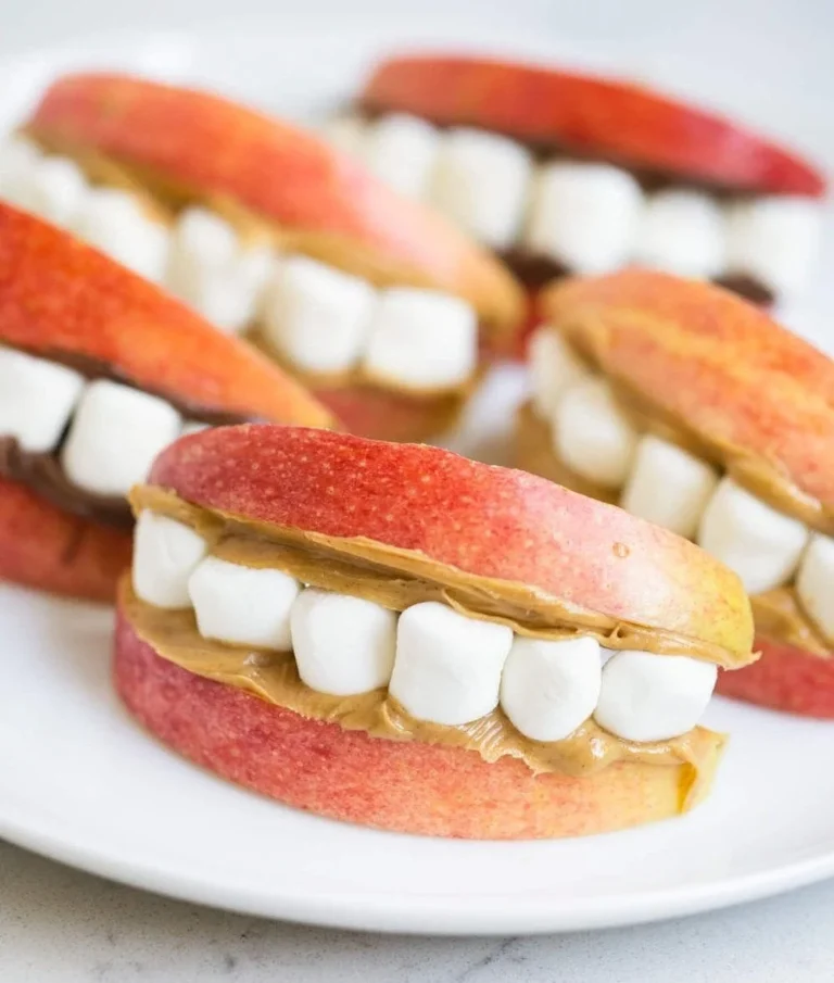 A variety of healthy Halloween snacks on a festive table.