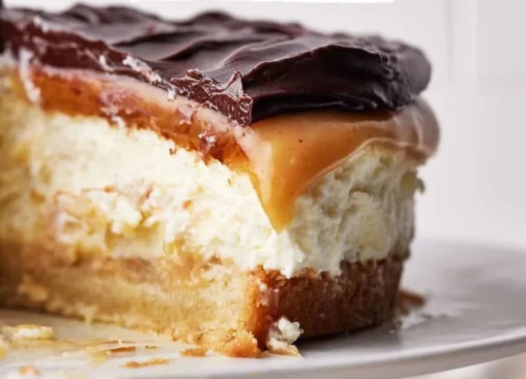 Delicious Millionaire's Cheesecake topped with caramel and chocolate ganache