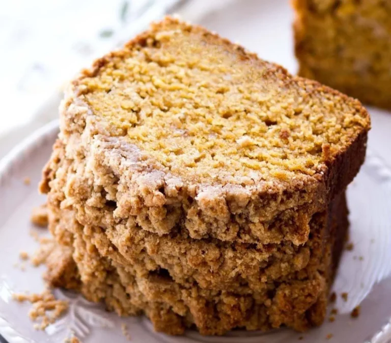 Delicious pumpkin bread topped with crumb for a perfect fall dessert