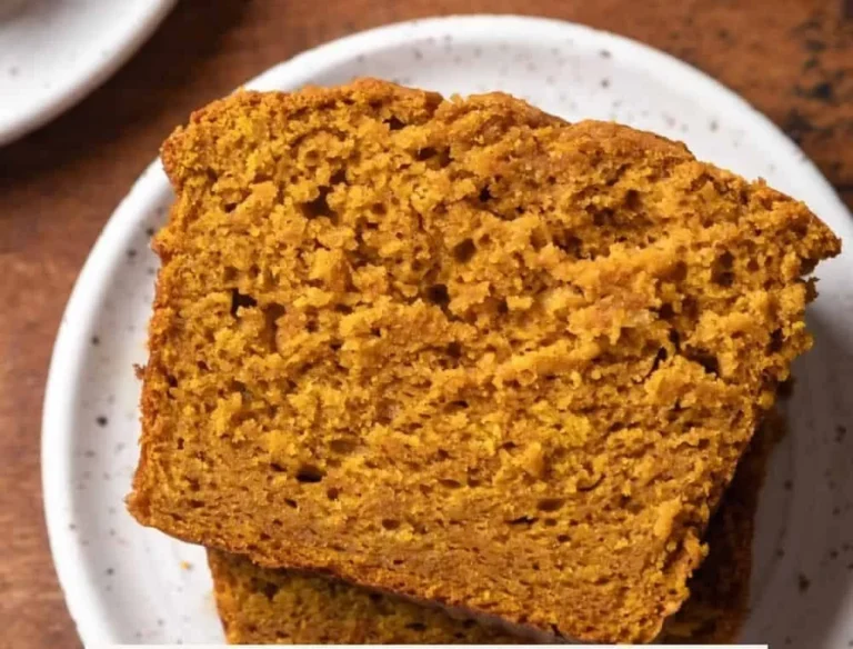 Delicious pumpkin bread with sour cream, garnished with cinnamon and nuts.