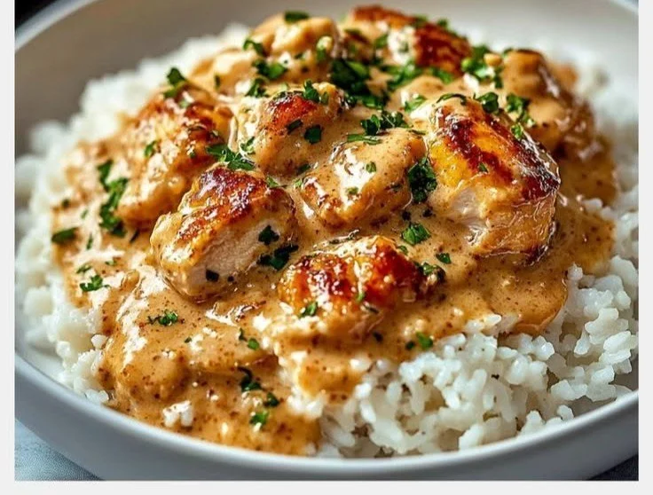Delicious smothered chicken served over fluffy rice with rich gravy.