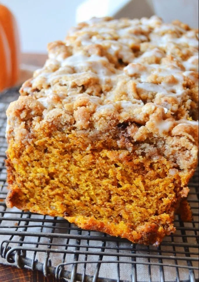 Delicious streusel-topped pumpkin apple bread with warm spices and fresh apples.