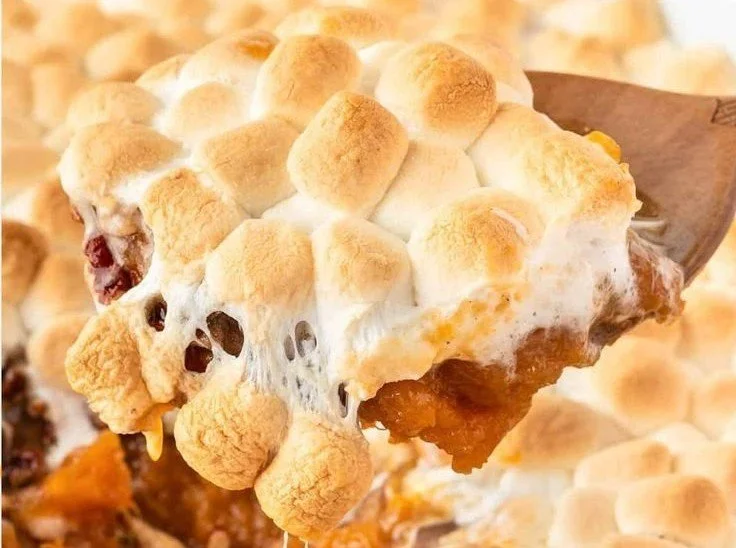 Delicious sweet potato casserole topped with fluffy marshmallows, ideal for holidays