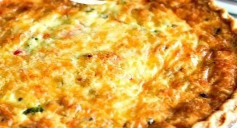 Delicious Western omelet quiche with peppers, onions, and cheese in a crust