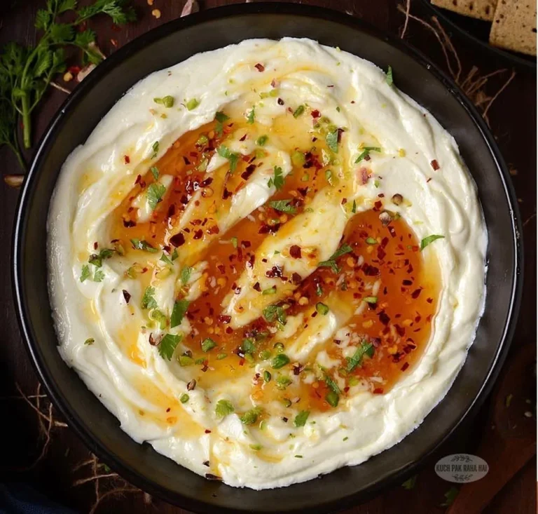 Whipped feta dip drizzled with honey served in a bowl